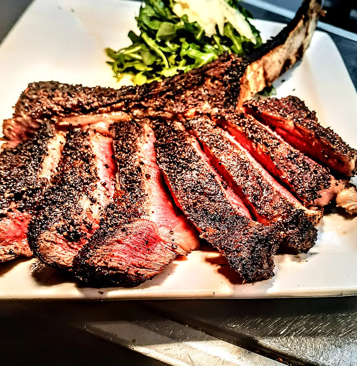 Chef-prepared plated steak presentation